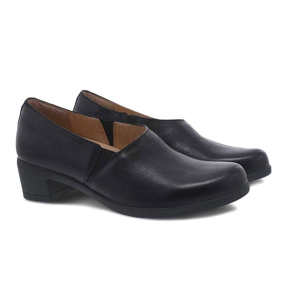 A pair of black leather Dansko Camdyn Black Burnished low-heeled shoes with Natural Arch technology on a white background.