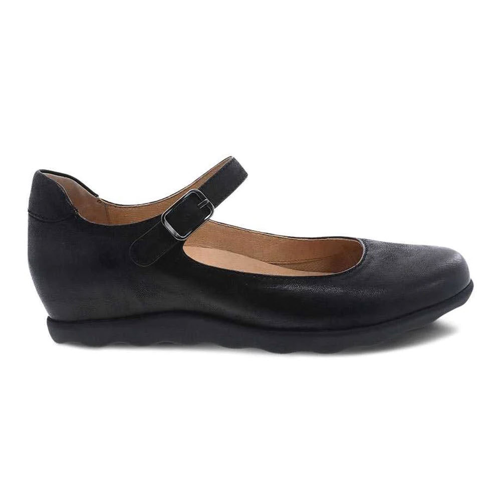 A Dansko Marcella Black Burnished - Womens style shoe in black Mary Jane design, featuring a strap and buckle on a white background.