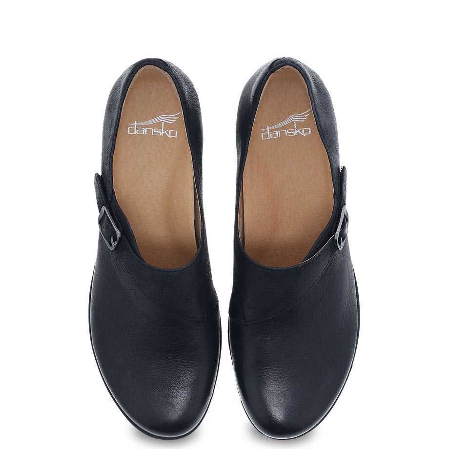 A pair of black Dansko Marisa Black Burnished mary jane shoes with a memory foam footbed on a white background.