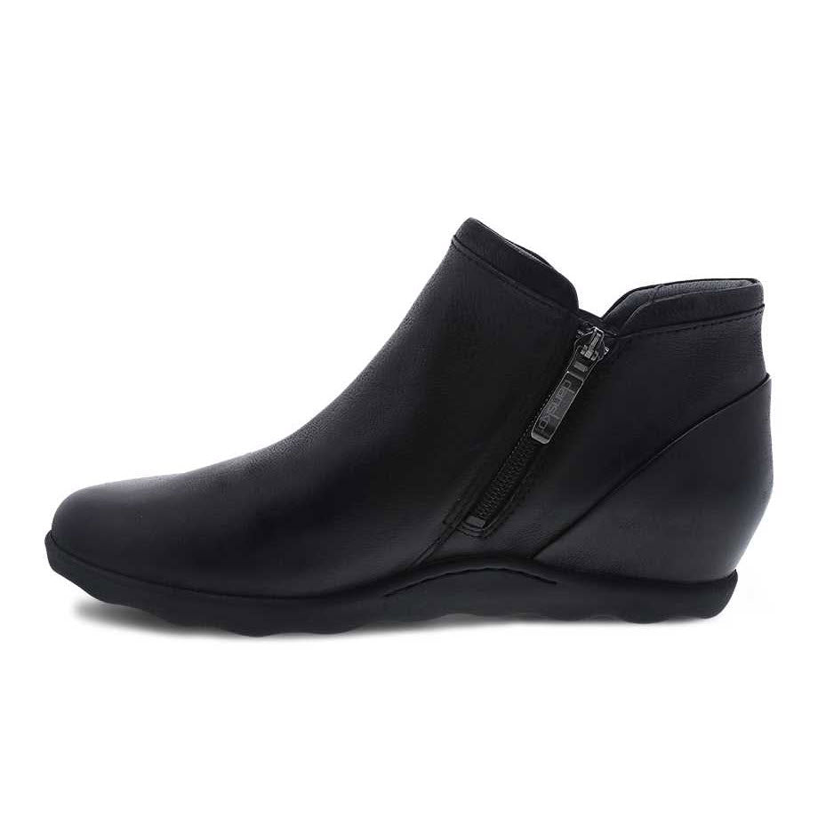 Dansko Miki Black Burnished boots by Dansko with a side zipper on a white background.