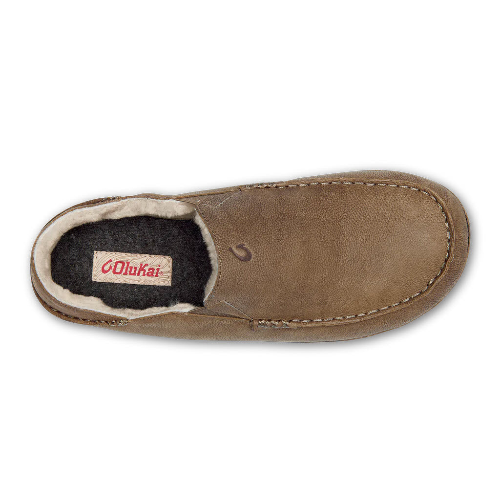 Top-down view of a single Olukai Kipuka Hulu Toffee/Totee slipper with a shearling lining.