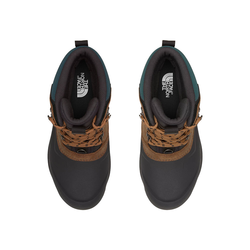 A top view of a pair of North Face Chilkat V Toasted Brown Mens hiking shoes with brown laces and black and teal accents, featuring Heatseeker Eco insulation.