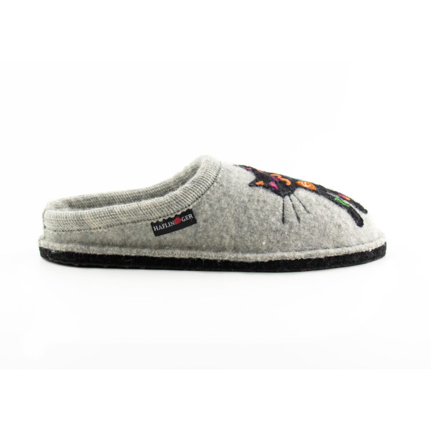 A Haflingers Sassy Grey slipper with a floral embroidery design on the toe, featuring a black sole and a visible brand label on the side.