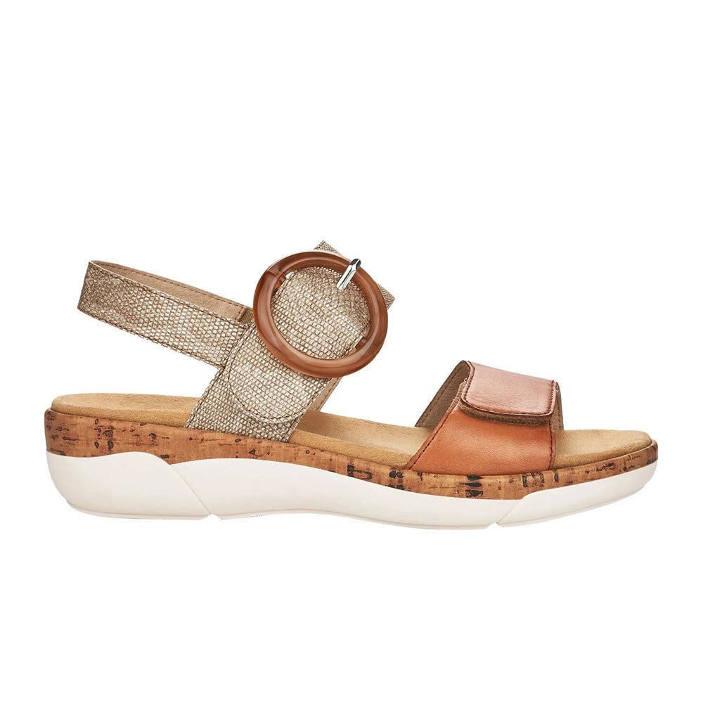 Side view of a Remonte Comfort Big Buckle Sandal in Tan/Silver with cork platform, featuring a metallic strap, a tan leather toe loop, and a white sole.