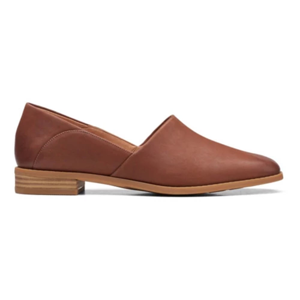 A brown leather loafer with a low heel and a rounded toe, displayed against a white background, featuring a Contour Cushion footbed - Clarks Pure Belle Dark Tan - Womens.