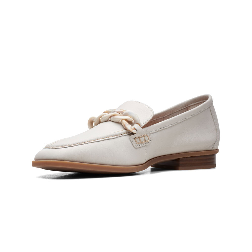 A single Clarks Sarafyna Iris White loafer with a chunky gold chain detail on a white background, featuring a slip-on style.