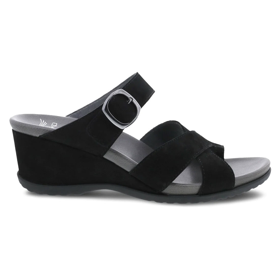 Dansko Aubree black nubuck wedge sandal with two uppers straps and a circular buckle on a white background.