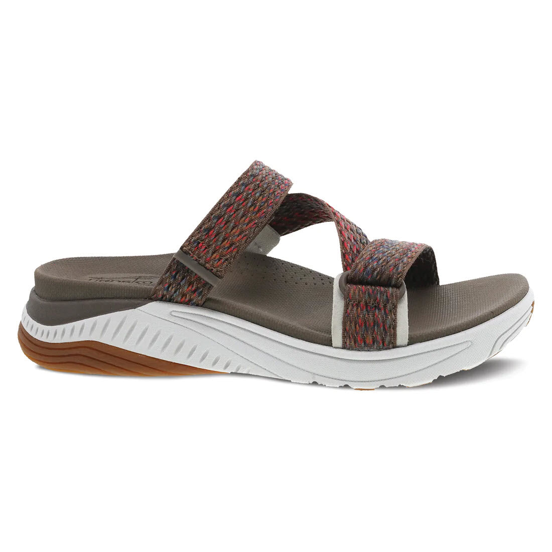 A single Dansko sandal with multicolored straps and a thick, contoured gray sole, isolated on a white background.