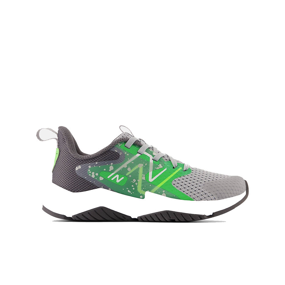 A gray and green New Balance Rave Run v2 Raincloud/Green kids&#39; running shoe with paint splatter design on a white background.