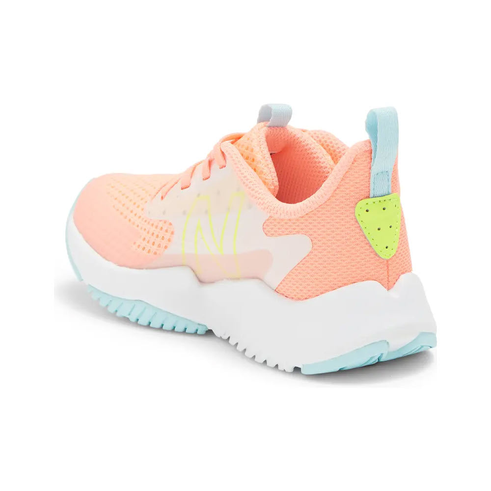 A modern New Balance Rave Run v2 sneaker in pastel pink and blue colors, featuring a breathable mesh upper and a flexible sole, isolated on a white background.