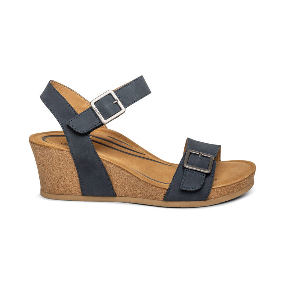 A navy blue, wedge-heeled AETREX LEXA sandal with adjustable straps and a cork platform, isolated on a white background.