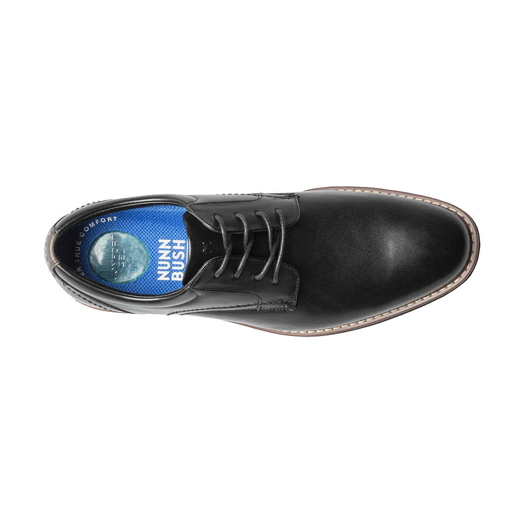 Black Nunn Bush Centro Flex plain toe dress shoe with a blue insole visible from above.