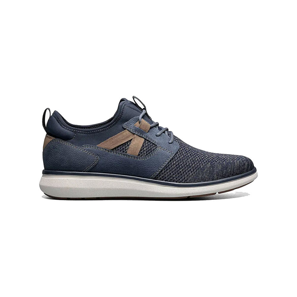 A single Florsheim VENTURE KNITE PLAIN TOE LACE UP NAVY - MENS sneaker with mesh fabric and suede accents, displayed against a white background.