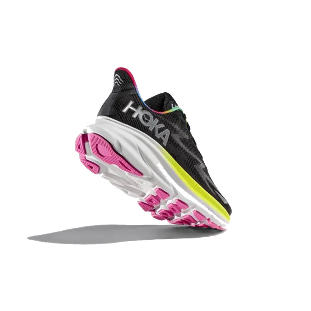 Black and pink HOKA CLIFTON 9 running shoe floating against a white background, showing the side profile and improved outsole design.