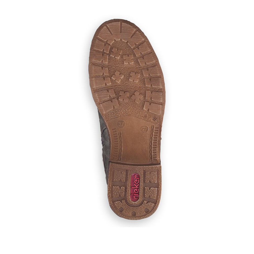 Sole of a Rieker Women&#39;s Boot displaying intricate tread pattern and a visible brand logo.