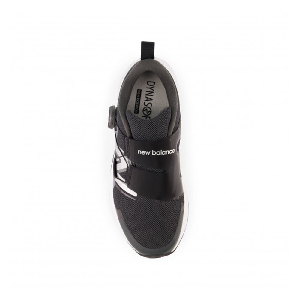 Top view of a single black New Balance Reveal V4 BOA Blacktop sneaker with a white sole, designed with the BOA Performance Fit System and the &quot;DynaSoft&quot; label.