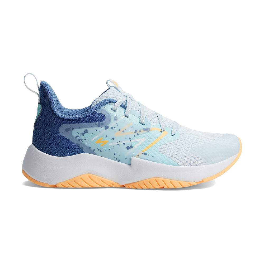 A light blue and white New Balance Rave Run V2 Ice Blue kids’ running shoe with an orange and white sole, featuring a breathable mesh upper and dynamic support design.