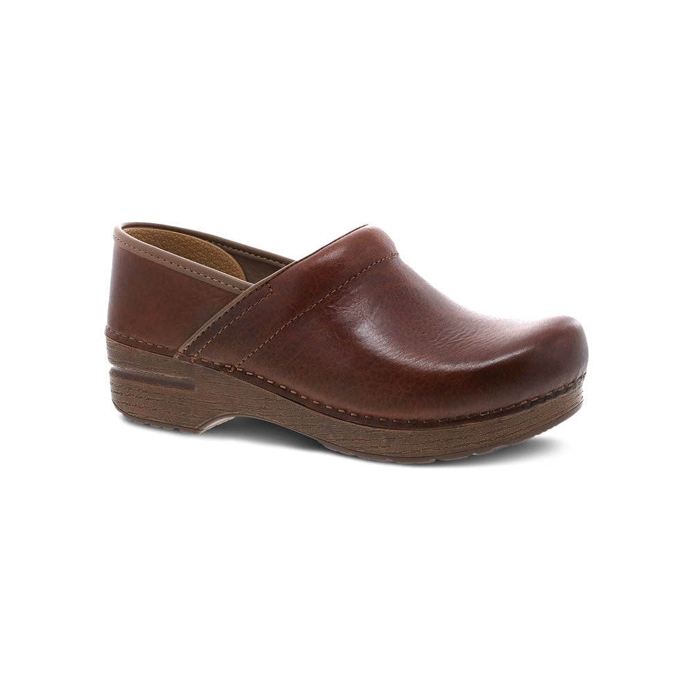 A single brown leather Dansko Prof Saddle Full Grain clog with a low heel and visible stitching, isolated on a white background.