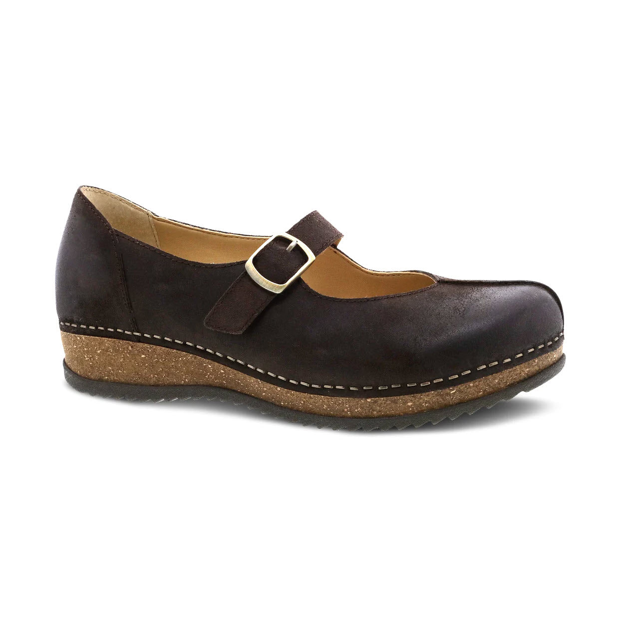 A single Dansko Mika Chocolate Burnished Suede Mary Jane shoe with a buckle strap and sustainable cork midsole, isolated on a white background.