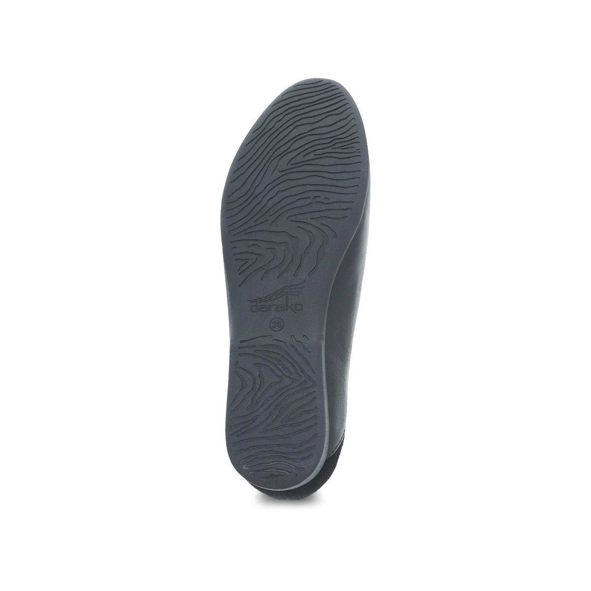 A single Dansko lace black glazed moc loafer sole displayed against a white background, with visible patterns and brand markings.