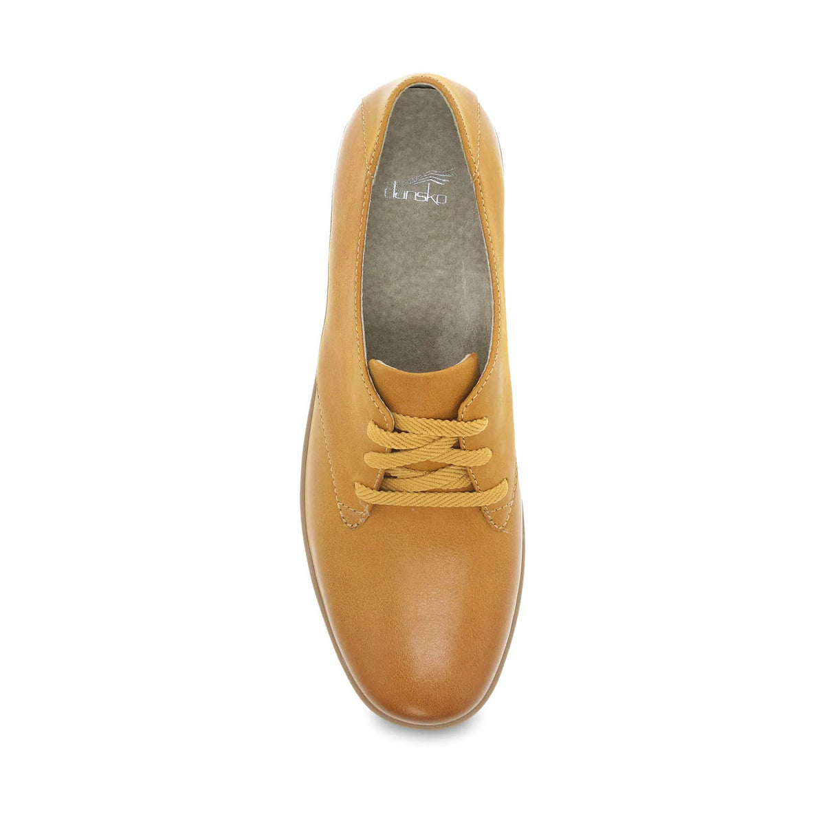 Top view of a single Dansko Libbie Mustard Burnished Oxford shoe with laces on a white background.