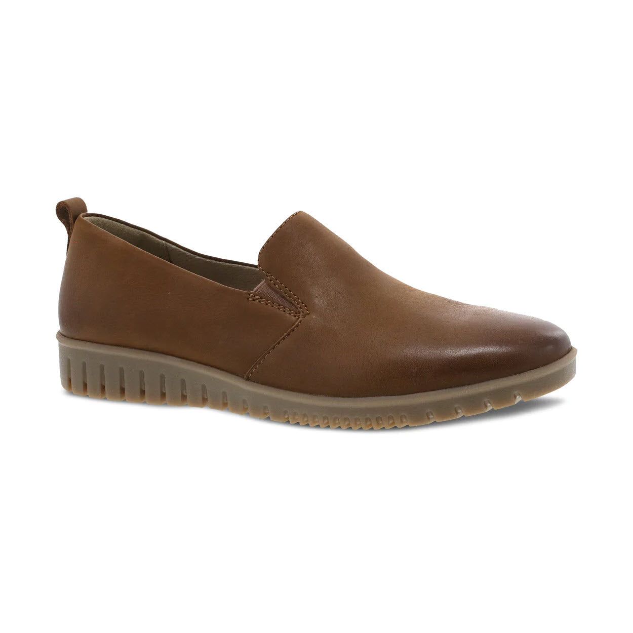 A Dansko Linley Tan Burnished slip-on shoe with a thick, ridged sole and molded arch shape, isolated on a white background.