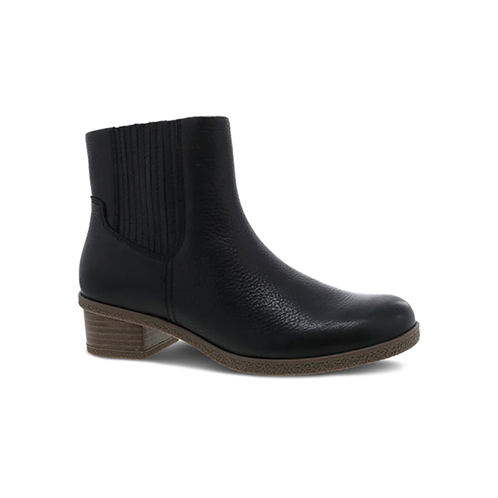 Dansko Daisie Black womens leather waterproof Chelsea boot with elastic side panels and a low, stacked heel, displayed on a white background.