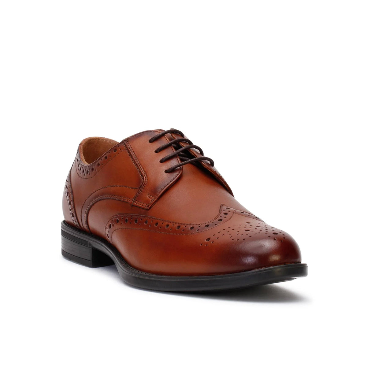 A single brown leather Florsheim Midtown Wingtip brogue shoe with decorative perforations, viewed from the side against a white background.