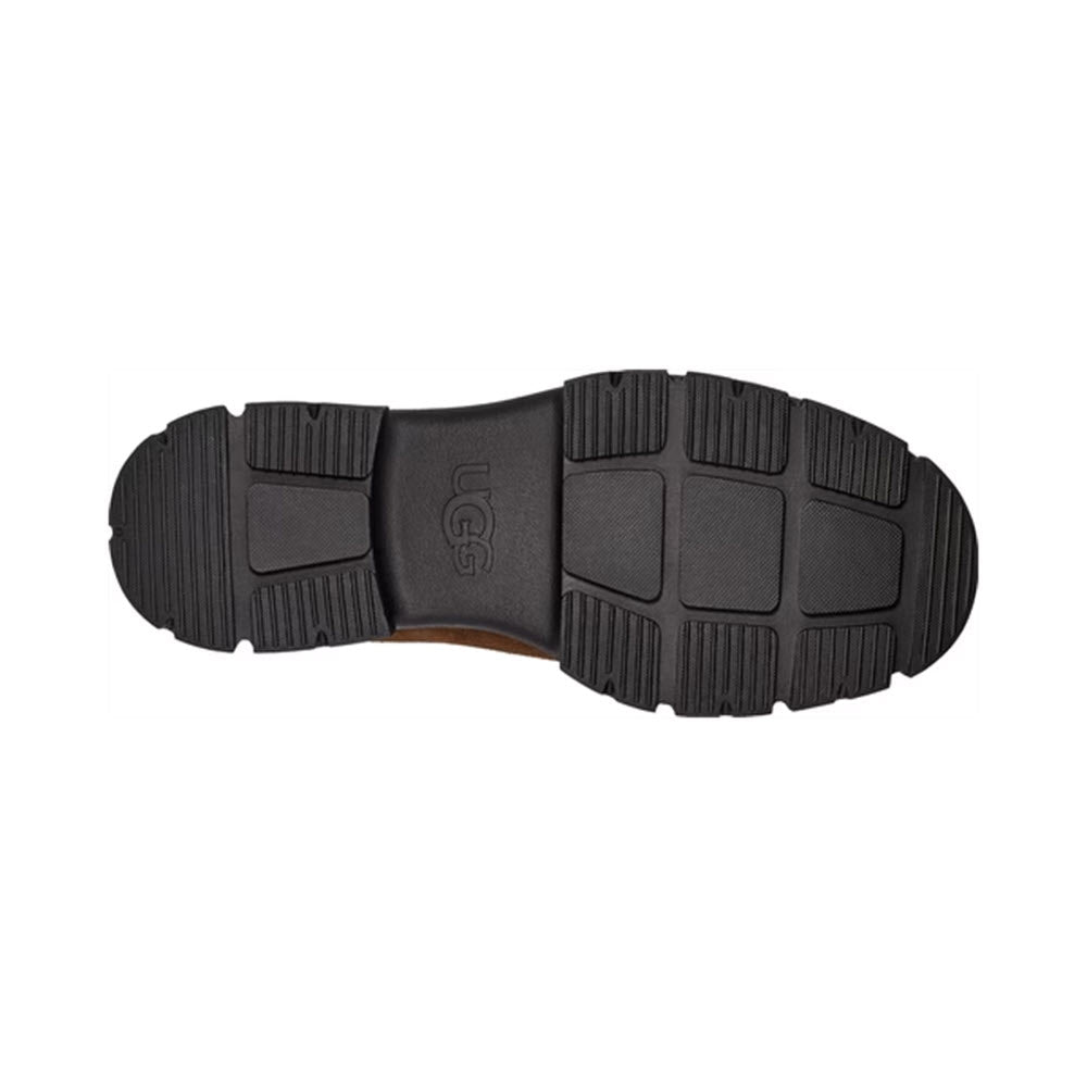 Sole of an UGG Ashton Chelsea Dark Earth - Womens showing the textured tread pattern and brand logo.
