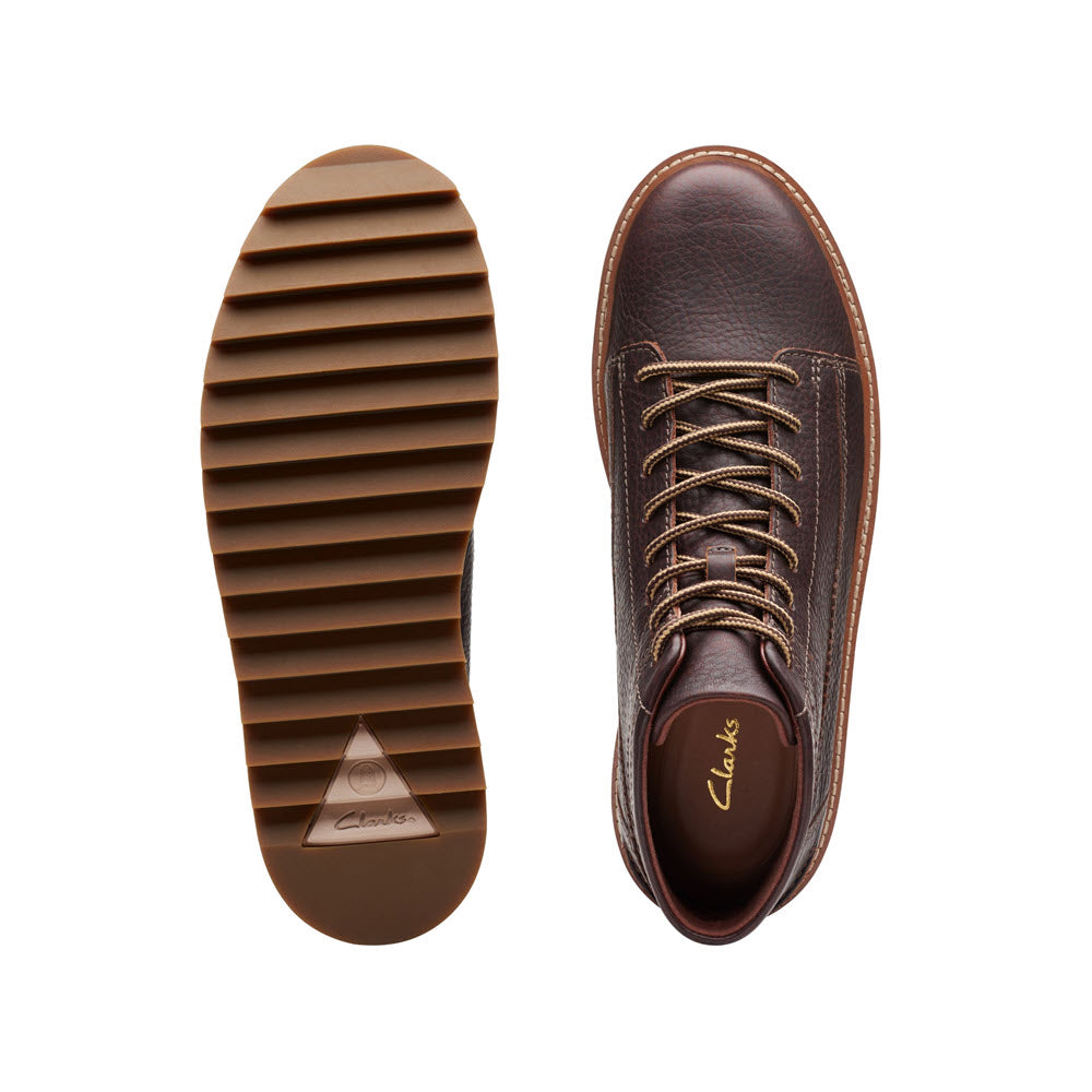 Top view of a single CLARKS CLARKHILL HI BOOT DARK BROWN LEATHER - MENS shoe with its sole displayed next to it on a white background.