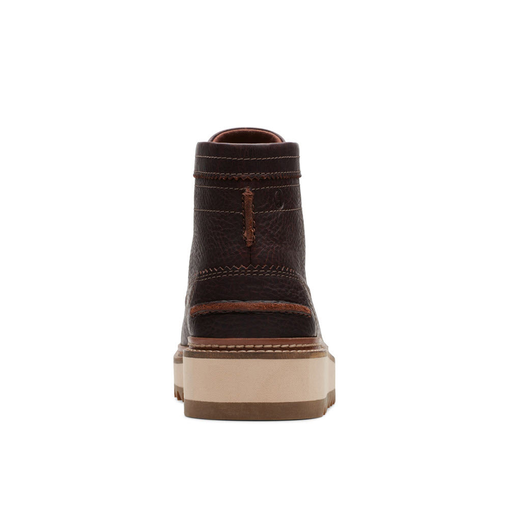 Rear view of a Clarks Clarks Hill Hi Boot dark brown leather boot displaying intricate stitching and a loop on the back, set against a white background.