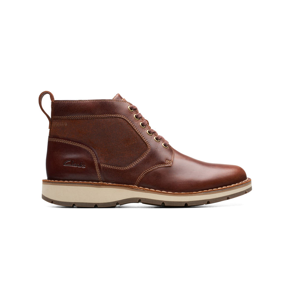 A single Clarks Gravelle Top Lace Boot crafted from premium leathers, featuring a lace-up closure and a sturdy sole, isolated on a white background.