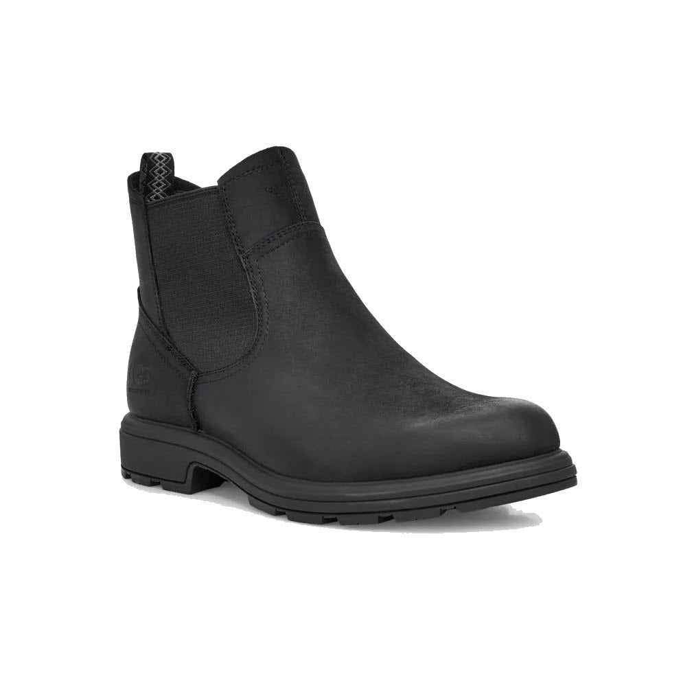 A Ugg Biltmore waterproof Chelsea black - mens boot with elastic side panels and a thick rubber sole, displayed on a white background.