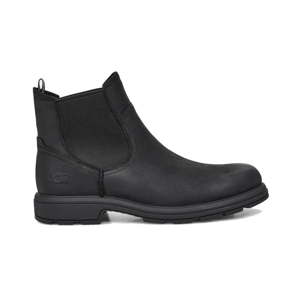 A black UGG BILTMORE waterproof Chelsea boot crafted from full-grain leather, with elastic side panels and a rear pull tab on a white background.