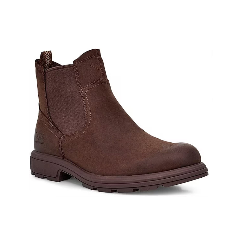 A single brown Ugg Biltmore waterproof full-grain leather chelsea boot with elastic side panels and a logo on the heel, displayed against a white background.
