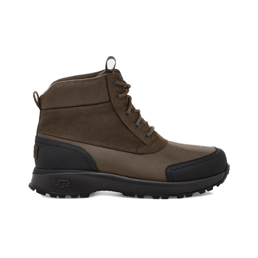A single brown and black UGG Emmett Duck Lace Boot Stout - Mens with lace-up front, waterproof leather, and a rubber sole, isolated on a white background.