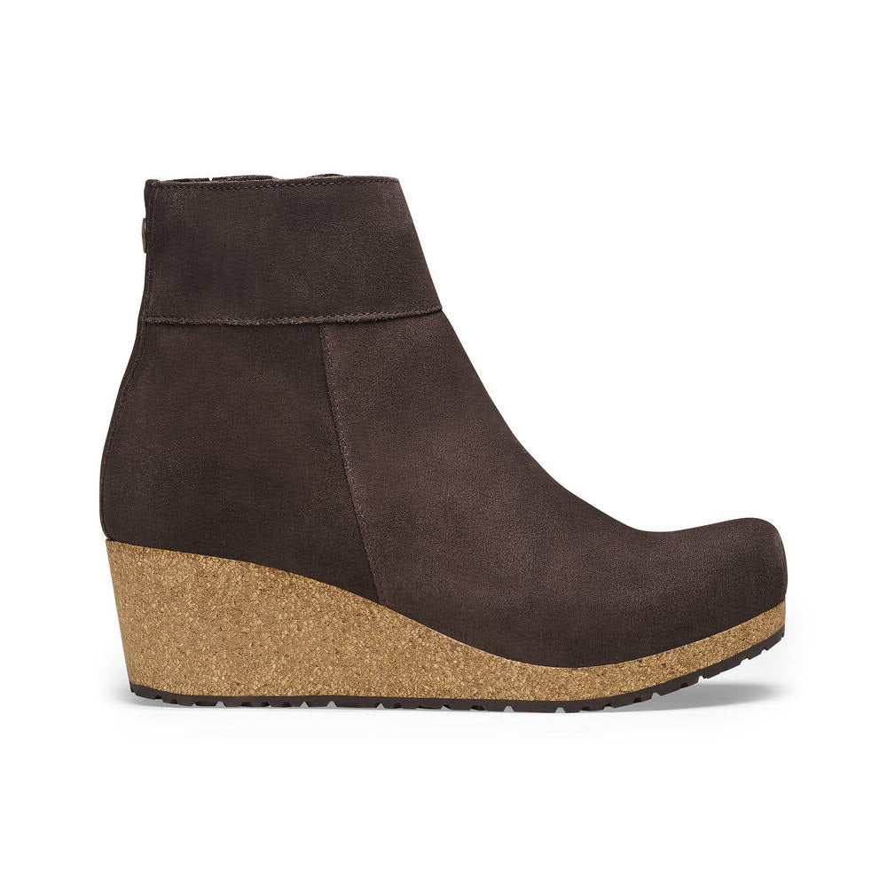 A brown suede Birkenstock Papillio Ebba ankle boot with a cork wedge heel and a white background.
