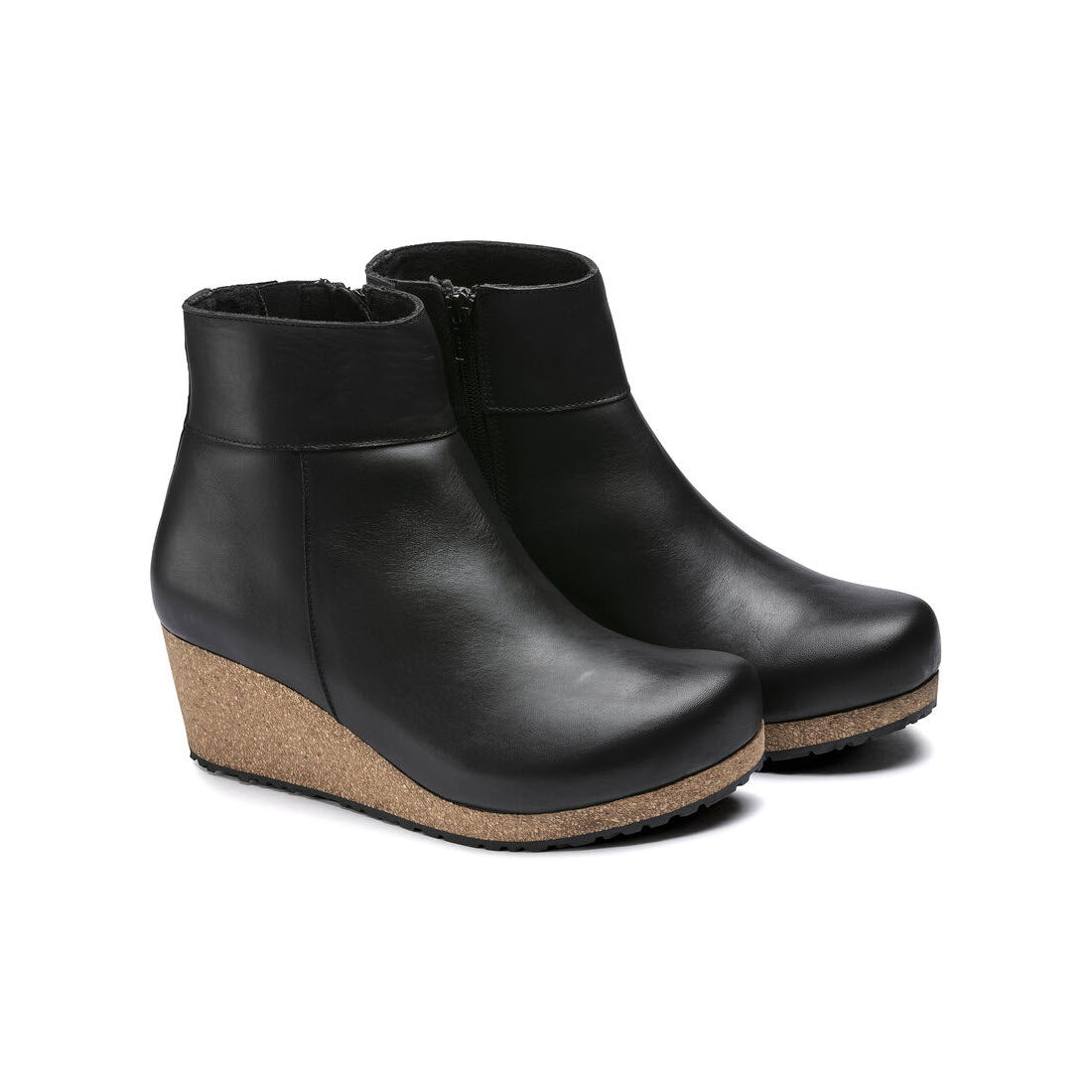 A pair of Birkenstock Papillio Ebba Black Leather wedge ankle boots with contoured footbeds and cork heels, isolated on a white background.