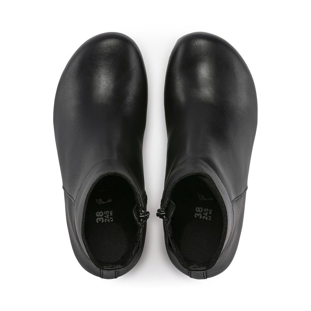 A pair of Birkenstock Papillio Ebba Black Leather ankle boots viewed from above, showing the top opening and the contoured footbed.