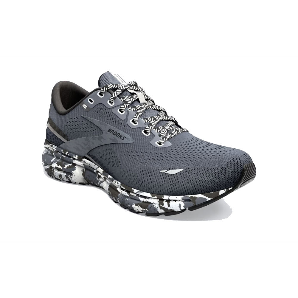A gray BROOKS GHOST 15 EBONY/BLACK/OYSTER running shoe with white and black camo-patterned soles, soft cushioning, and white laces.