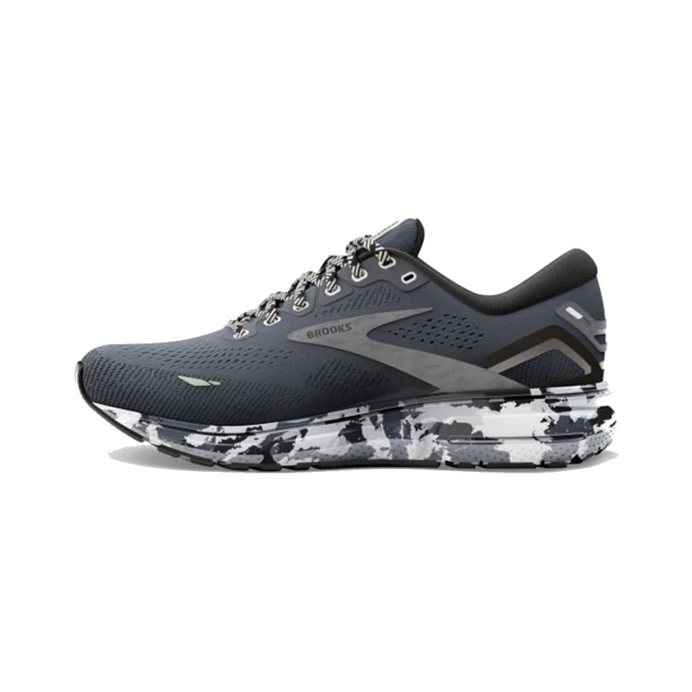 A pair of Brooks Ghost 15 running shoes with an ebony/black/oyster upper, soft cushioning, and a white and black speckled sole.