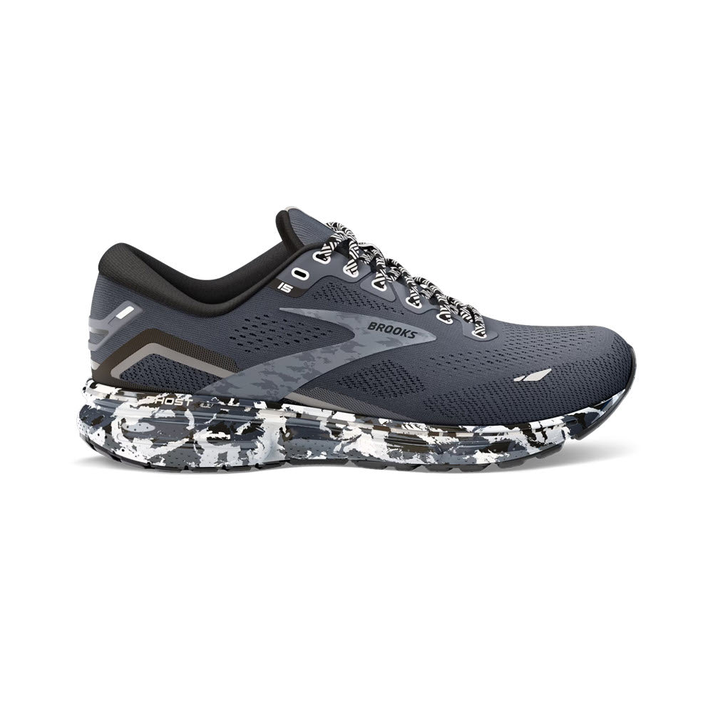 A pair of Brooks Ghost 15 Ebony/Black/Oyster running shoes in gray with a white and black speckled sole, featuring reflective details and lace-up fronts.
