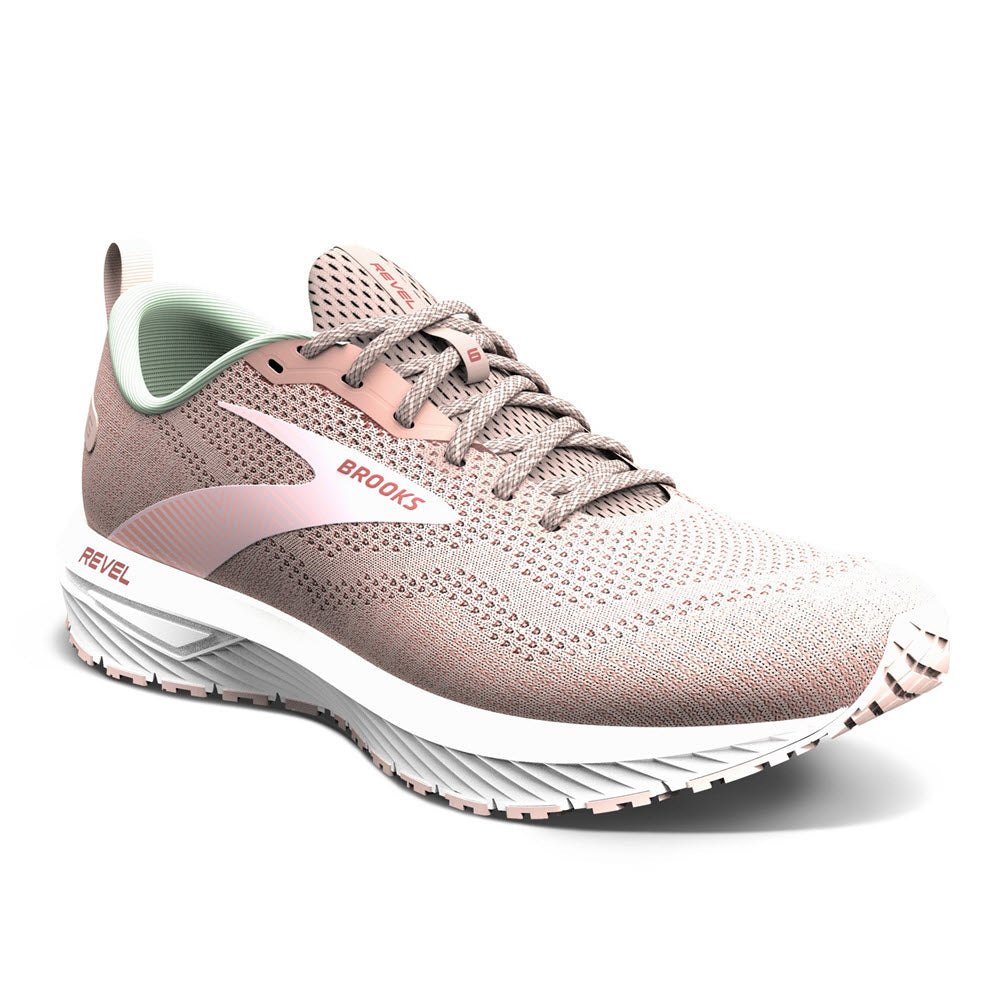 A pink and white Brooks Revel 6 Peach Whip/Pink women&#39;s road-running shoe with a green interior, showcasing the revel model with enhanced cushioning, isolated on a white background.