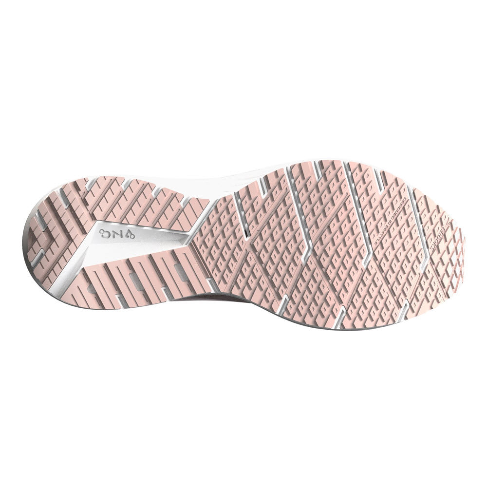 Bottom view of a women&#39;s Brooks Revel 6 Peach Whip/Pink road-running shoe sole with tread pattern in pink and beige colors, displaying the brand &quot;Brooks&quot;.