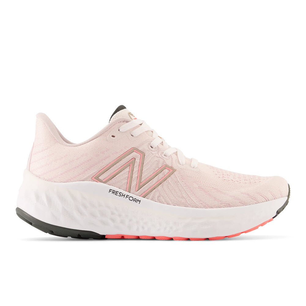 A light pink New Balance women's running shoe, featuring a cushioned stable ride with a white sole and the logo on the side, isolated on a white background.