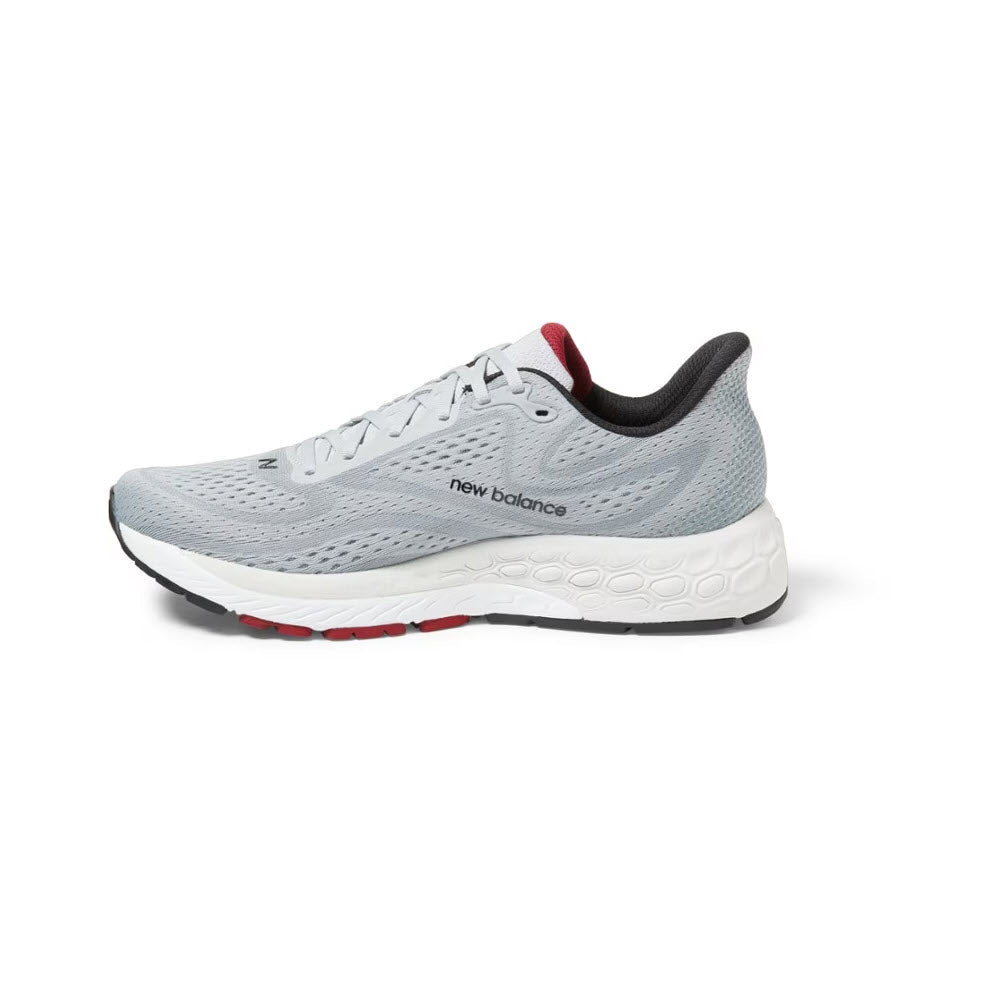 A single gray New Balance 880v13 running shoe on a white background, featuring a white sole with red accents.
