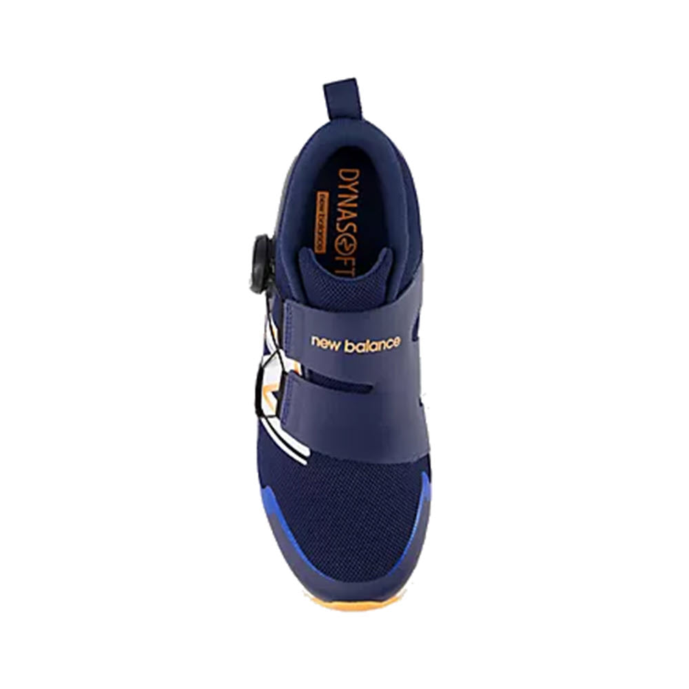 Top view of a new New Balance Reveal v4 BOA Navy kids&#39; sneaker in blue and black with a hook-and-loop strap and orange accents on the sole.
