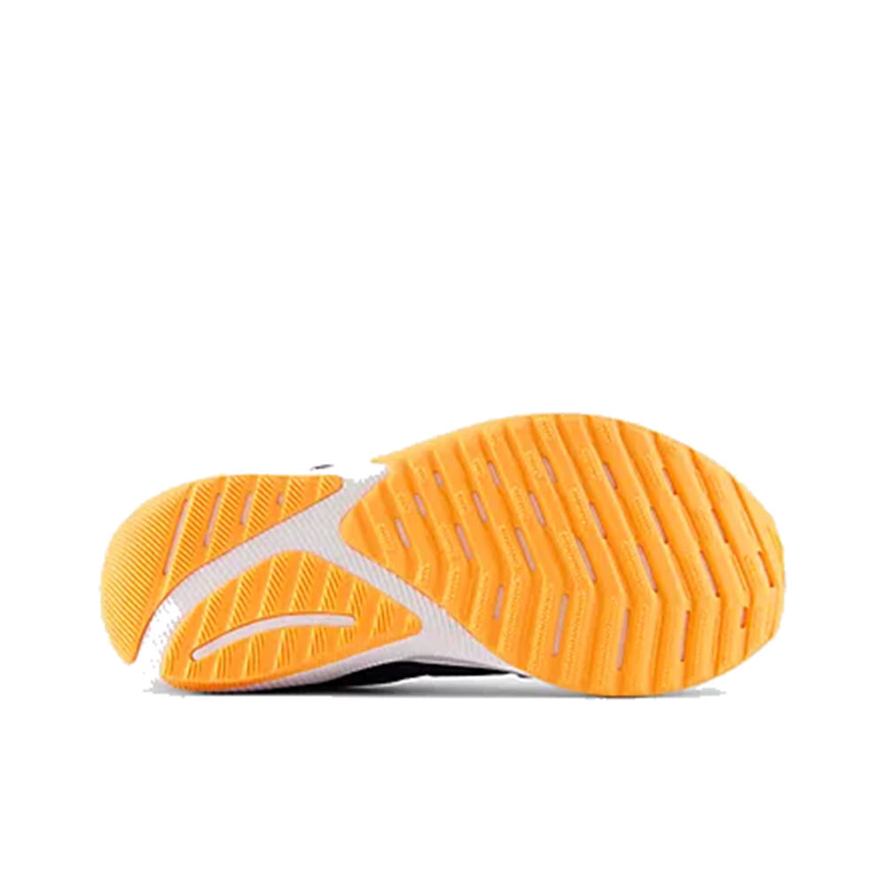 Orange and white rubber shoe sole with a textured tread pattern from the New Balance Reveal V4 BOA Navy - Kids, displayed on a white background.
