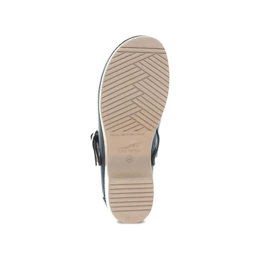 Bottom view of a modern Dansko skate shoe with herringbone pattern on the sole and silver hardware.