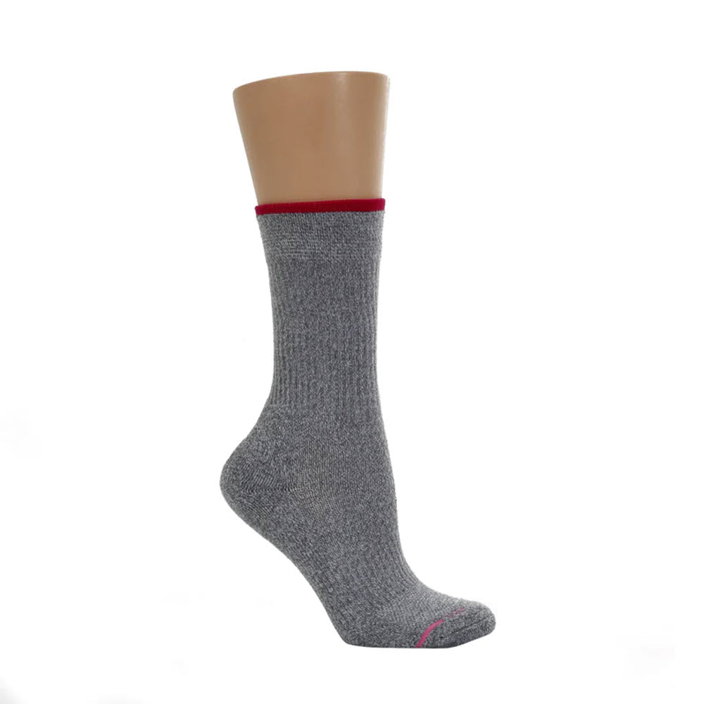 A single DR MOTION COMPRESSION CREW CHARCOAL sock with a red band at the top, displayed on a mannequin foot against a white background.